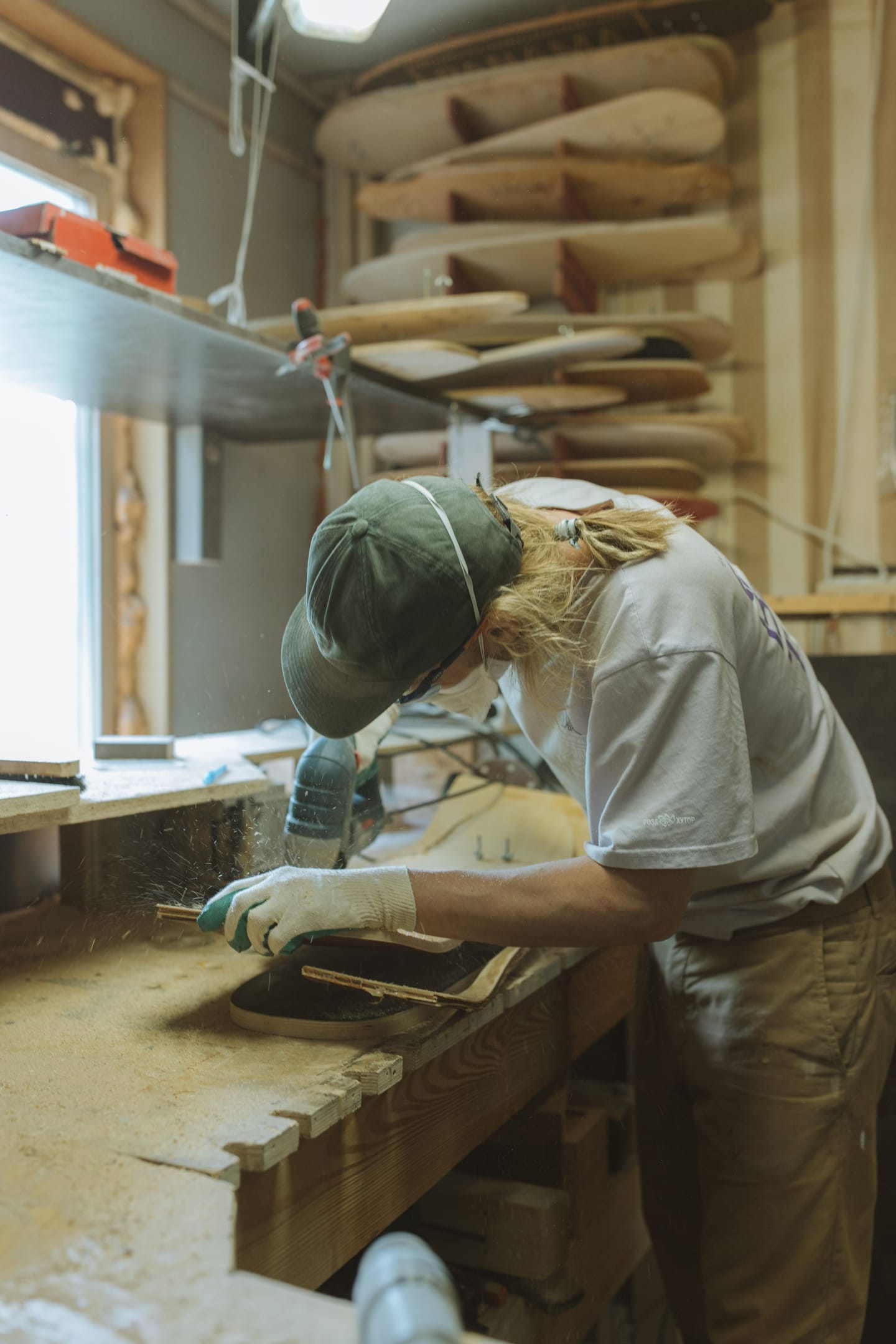Craftsman sanding a furniture part
