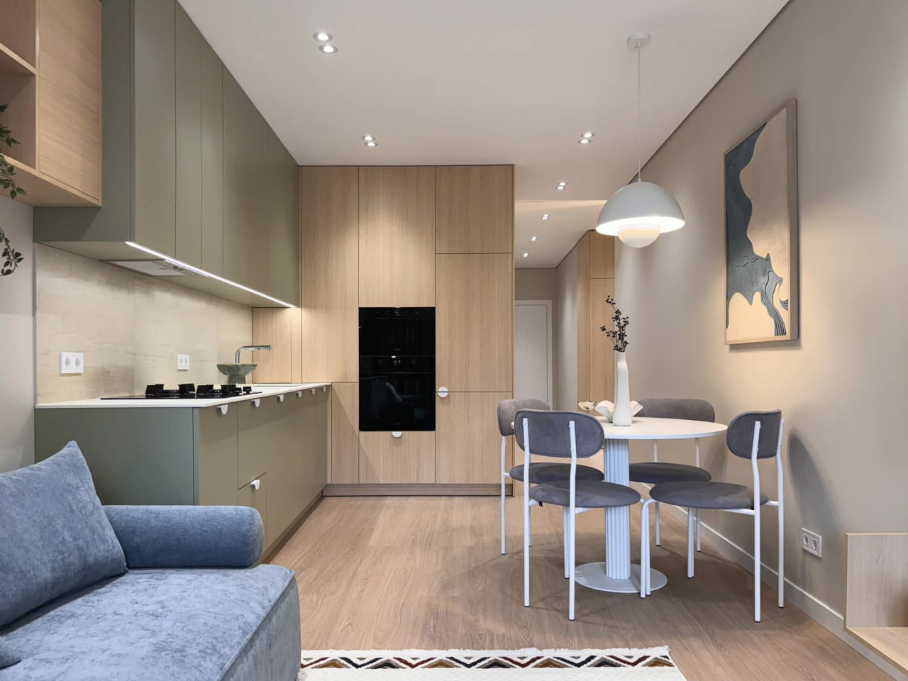 Maelis apartment — sage kitchen and oak built-ins