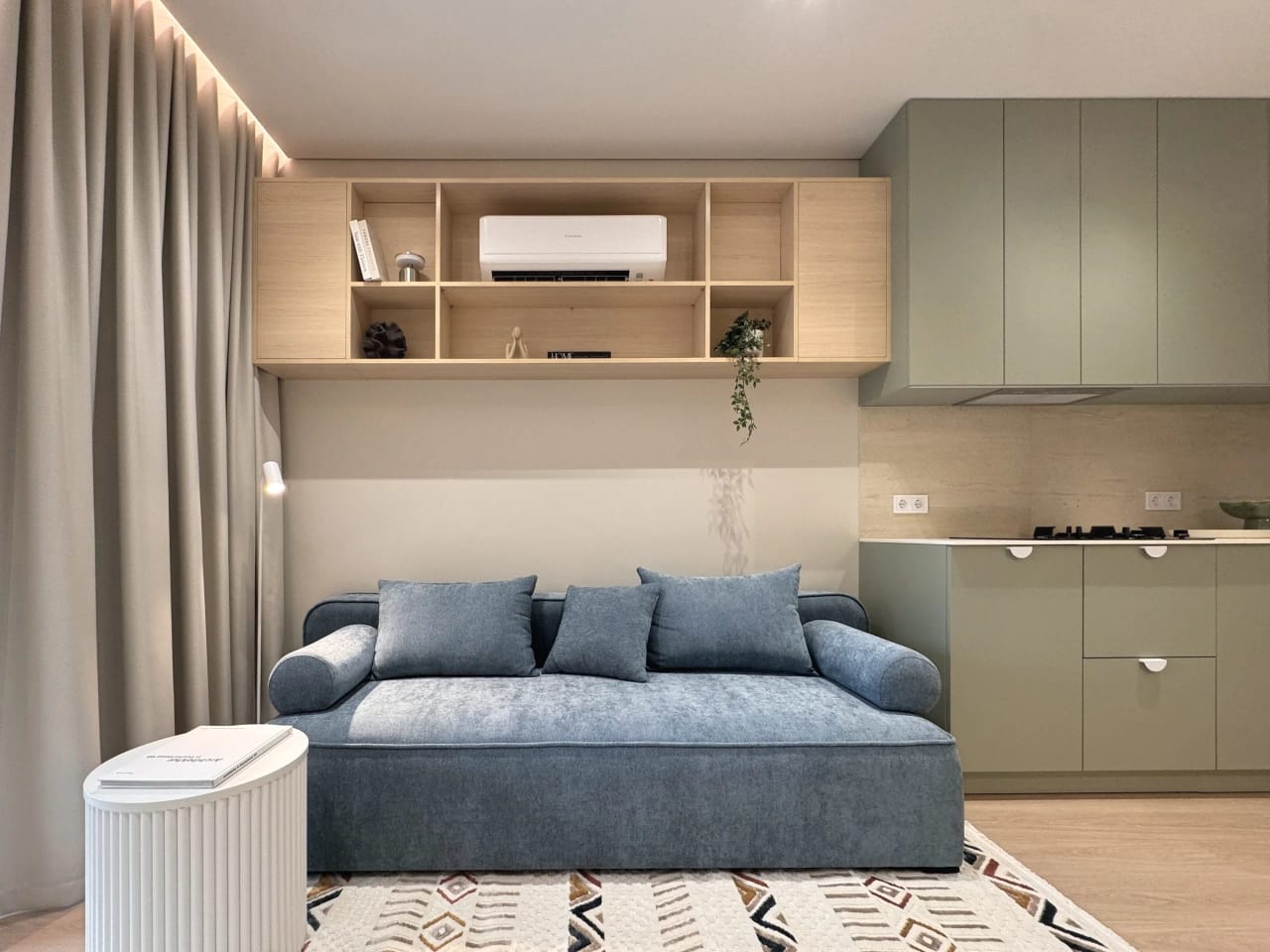 Maelis apartment — sage kitchen and oak built-ins — 2